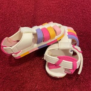 Cute, multi-colored summer shoes for toddler.
